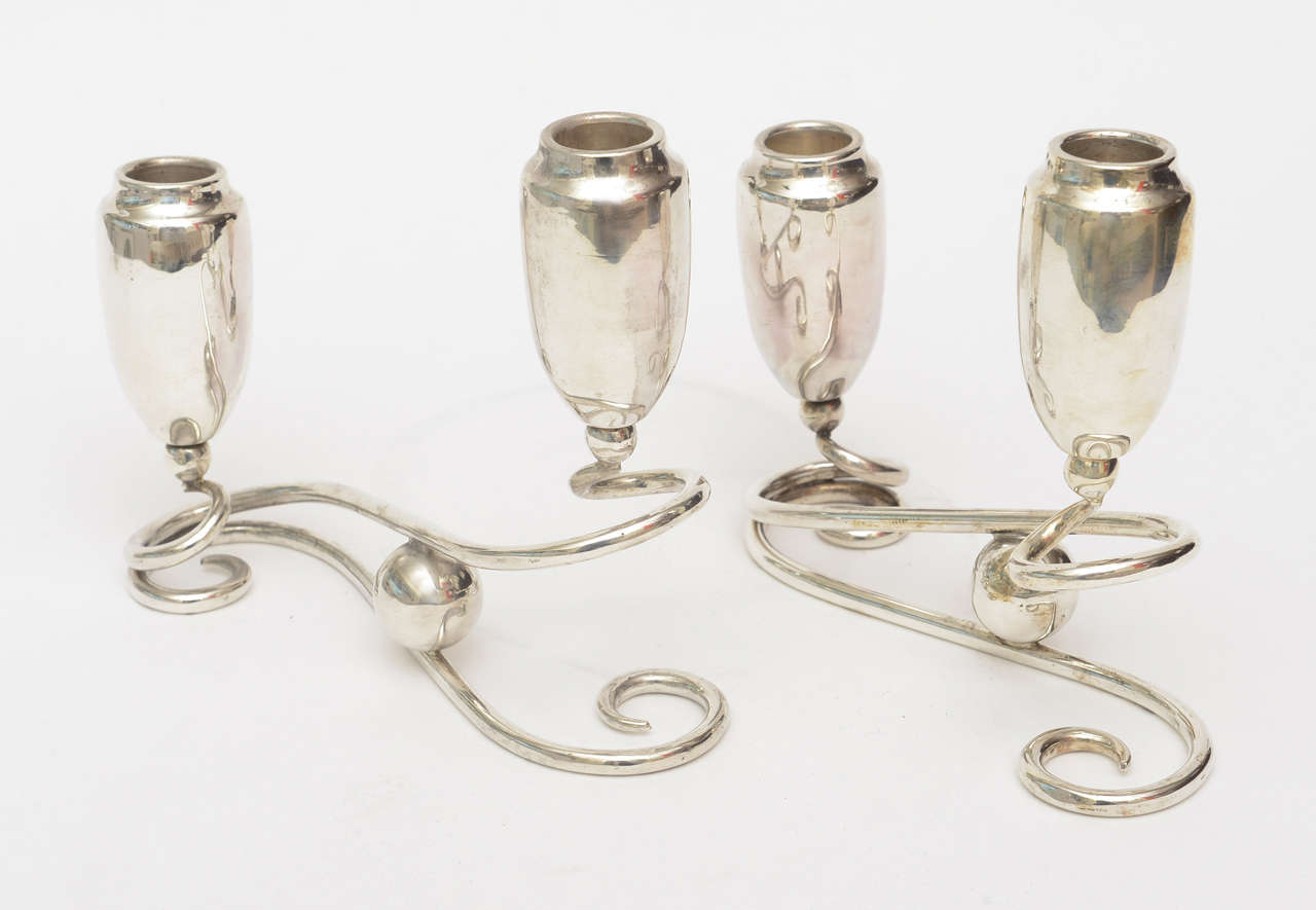 These lovely and elegant pair of sterling silver unmarked candlesticks have the ball motif and can be placed in so many different configurations on any table. They are both modern in look and period in time.