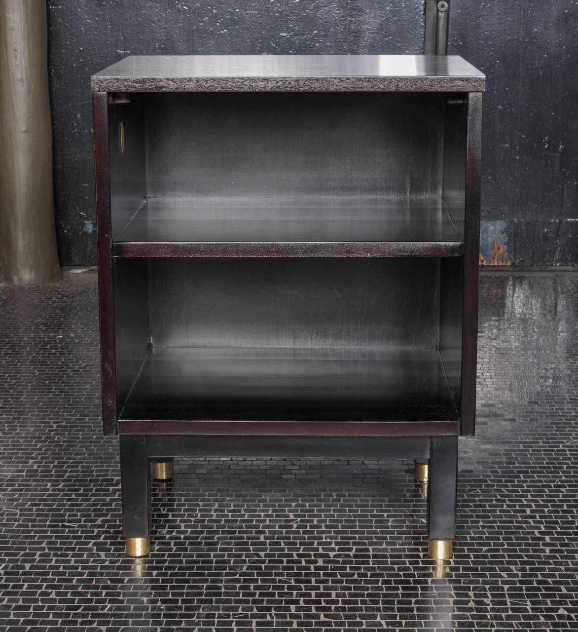 Pair of Edward Wormley ebonized maple bedside tables with brass details, manufactured by Dunbar, 1950s.
