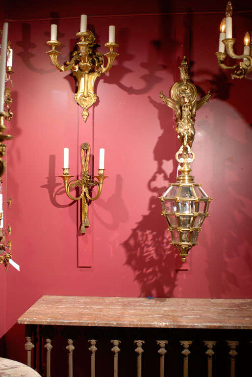 Fine pair of gilt bronze two light sconces with oak leaves, hunting horn arms, and tassel detail at the bottom