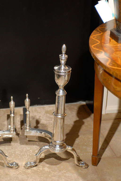 PAIR OF 20thC AMERICAN SILVERED ANDIRONS WITH URN FINIAL 1