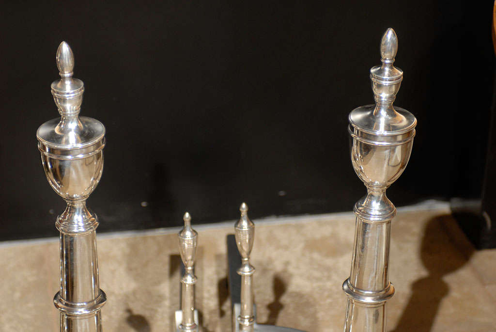 PAIR OF 20thC AMERICAN SILVERED ANDIRONS WITH URN FINIAL 2