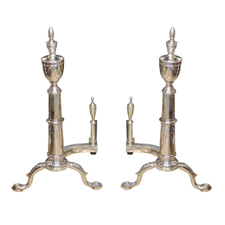 PAIR OF 20thC AMERICAN SILVERED ANDIRONS WITH URN FINIAL
