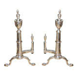 PAIR OF 20thC AMERICAN SILVERED ANDIRONS WITH URN FINIAL