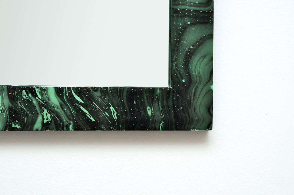 Faux malachite mirror in the style of Fornasetti, possibly a custom piece.