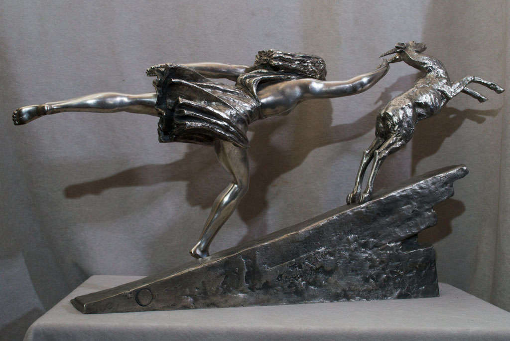 This has always been one of our favorite sculptures. It has that desired look of a great hood ornament. The young maiden is really chasing that hind. It is pictured in the Bryan Catley book "Art Deco and Other Figurines" on page 241. The