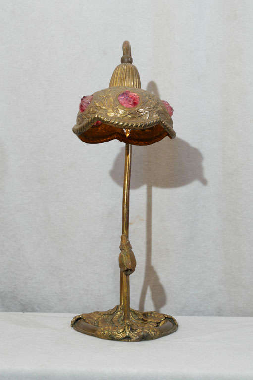 This very organic and whimsical little art nouveau lamp has a beautiful warm gold finish and five exotic chunk jewels.  This is a very delicate and well made lamp.
Shade diameter is shown below.