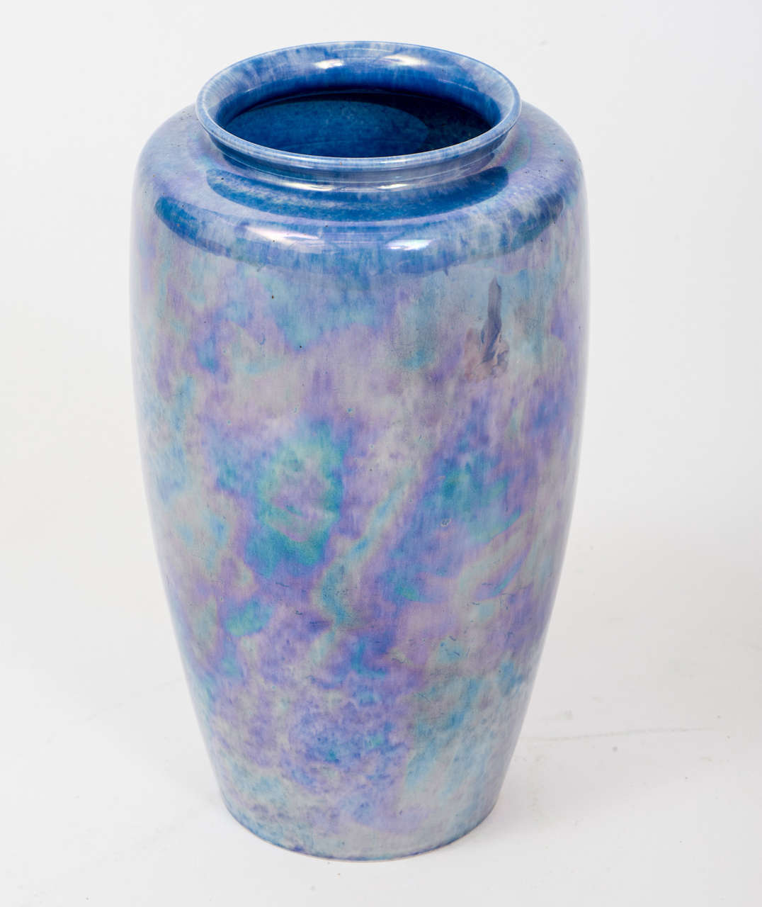 William Howson Taylor founded the Ruskin Art Pottery with his father in Smethwick, England in 1898 to be run in line with Arts & Crafts principles. Over the next 35 years he pioneered the development of a variety of innovative glazes, many of them