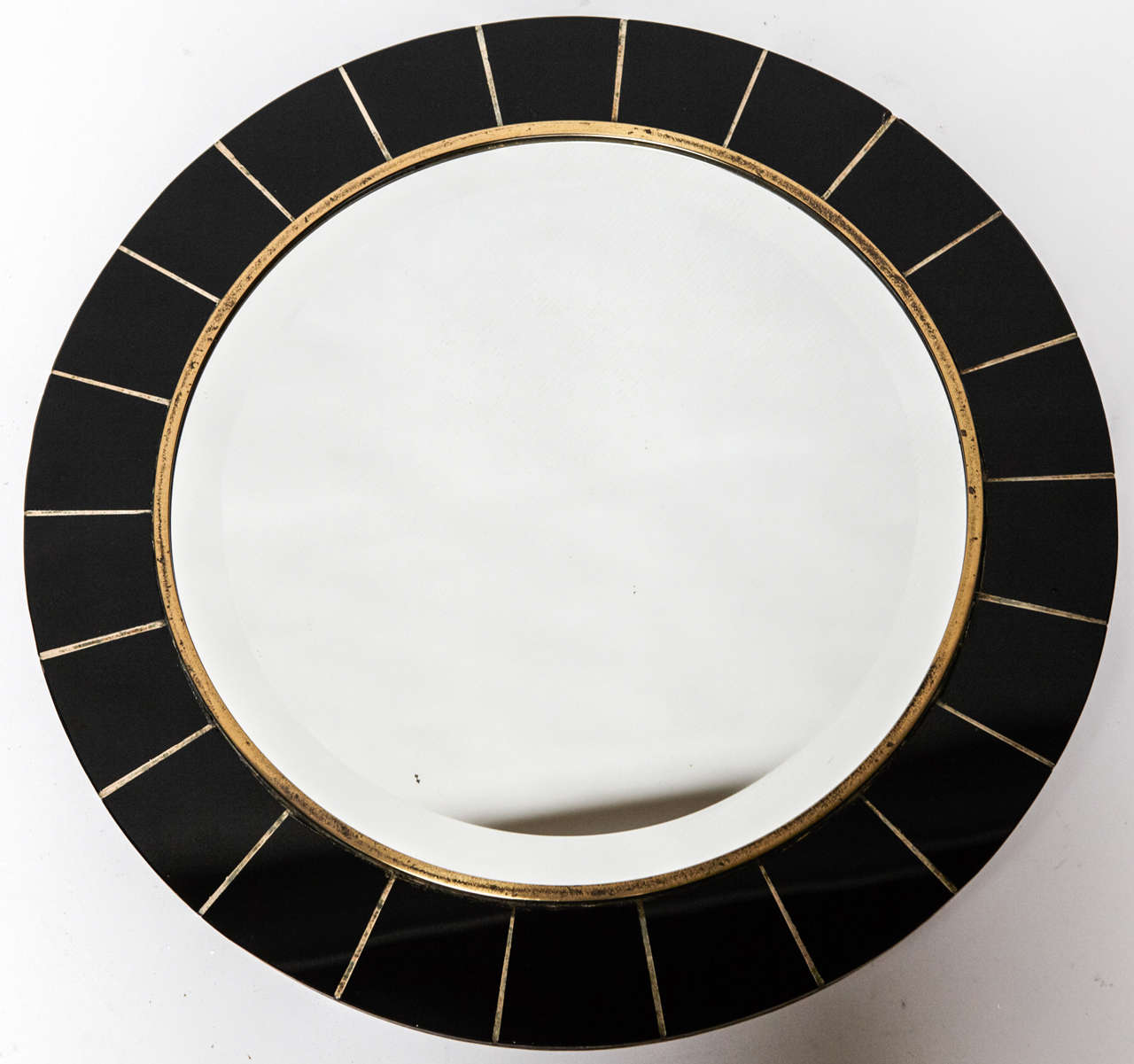 Very elegant 1950's round wall mirror ,with black enameled bakelite,  grinded mirror , brass frame and wood backside .