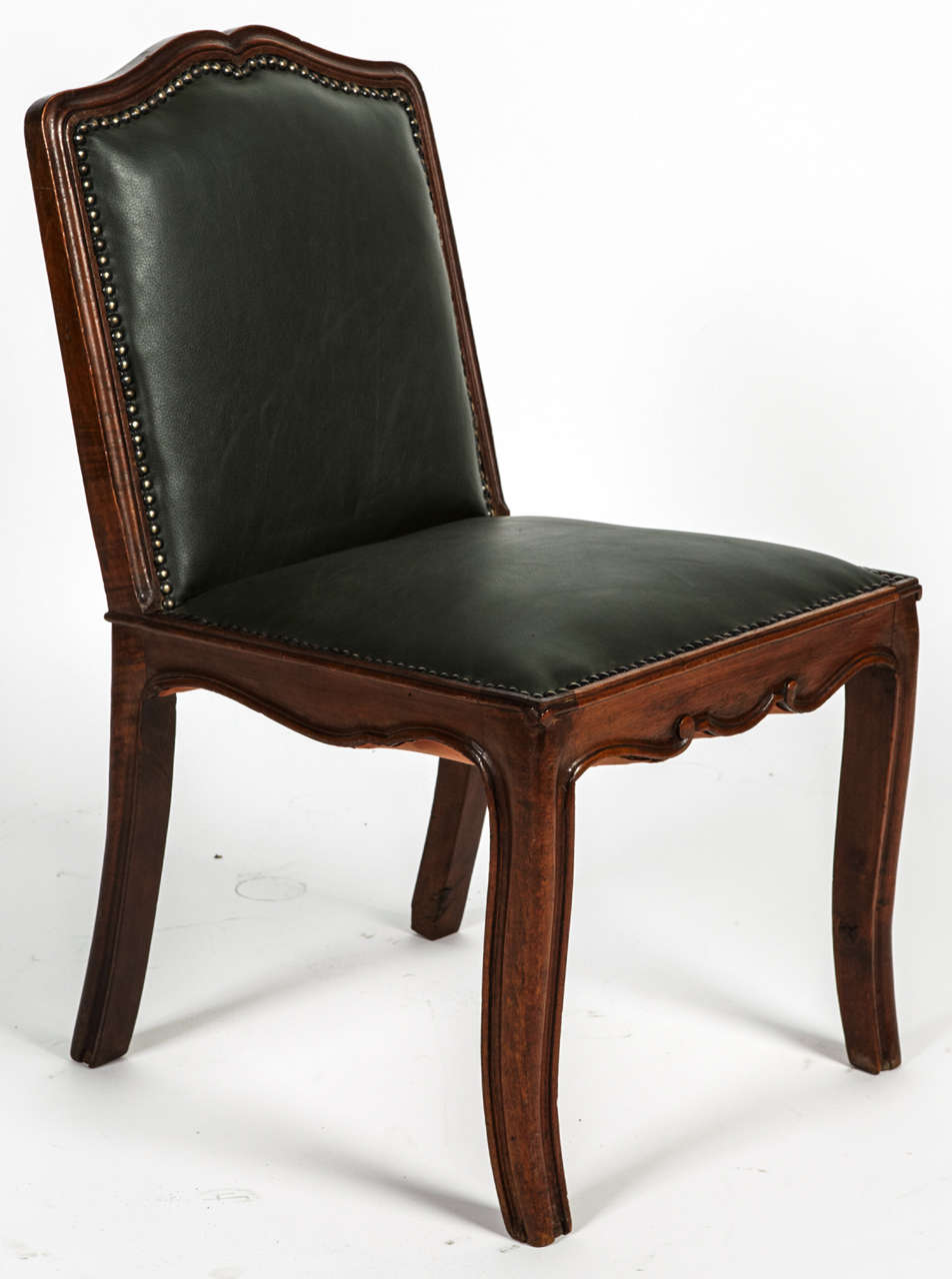 Small 18th century italian carved walnut chairs, with new green leather upholstery.