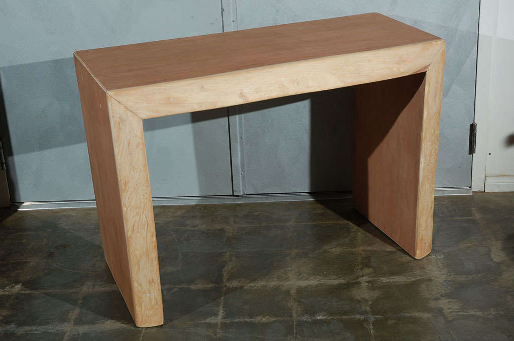 A good Ron Mann console having simple and rigid lines. Another item of this style is available.
