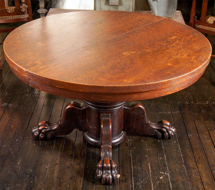 You Just Cant Hide Those Big Feet. American oak pedestal table with classical design.  Large Neo-Grec carved paws with a playful knee, supporting a center pedestal and quarter sawn oak veneer circular top. Retains its original finish, with dark