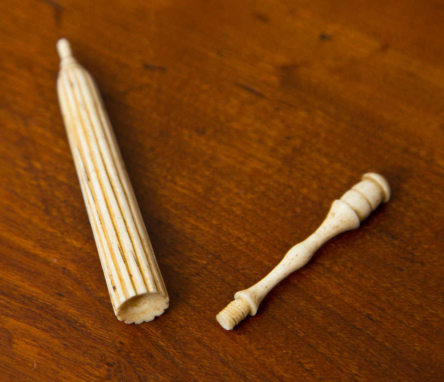 A very rare whale Ivory scrimshaw umbrella form needle-holder. Throughout the 19th century whalers would practice the art of scrimshaw to keep themselves occupied since many whaling voyages could last between 3 and 5 years or more and several weeks
