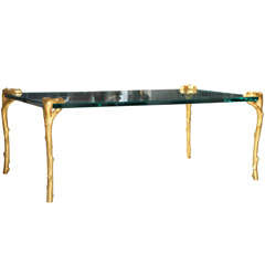 A Rectangular Glass Top Coffee Table with Gilt Bronze Legs