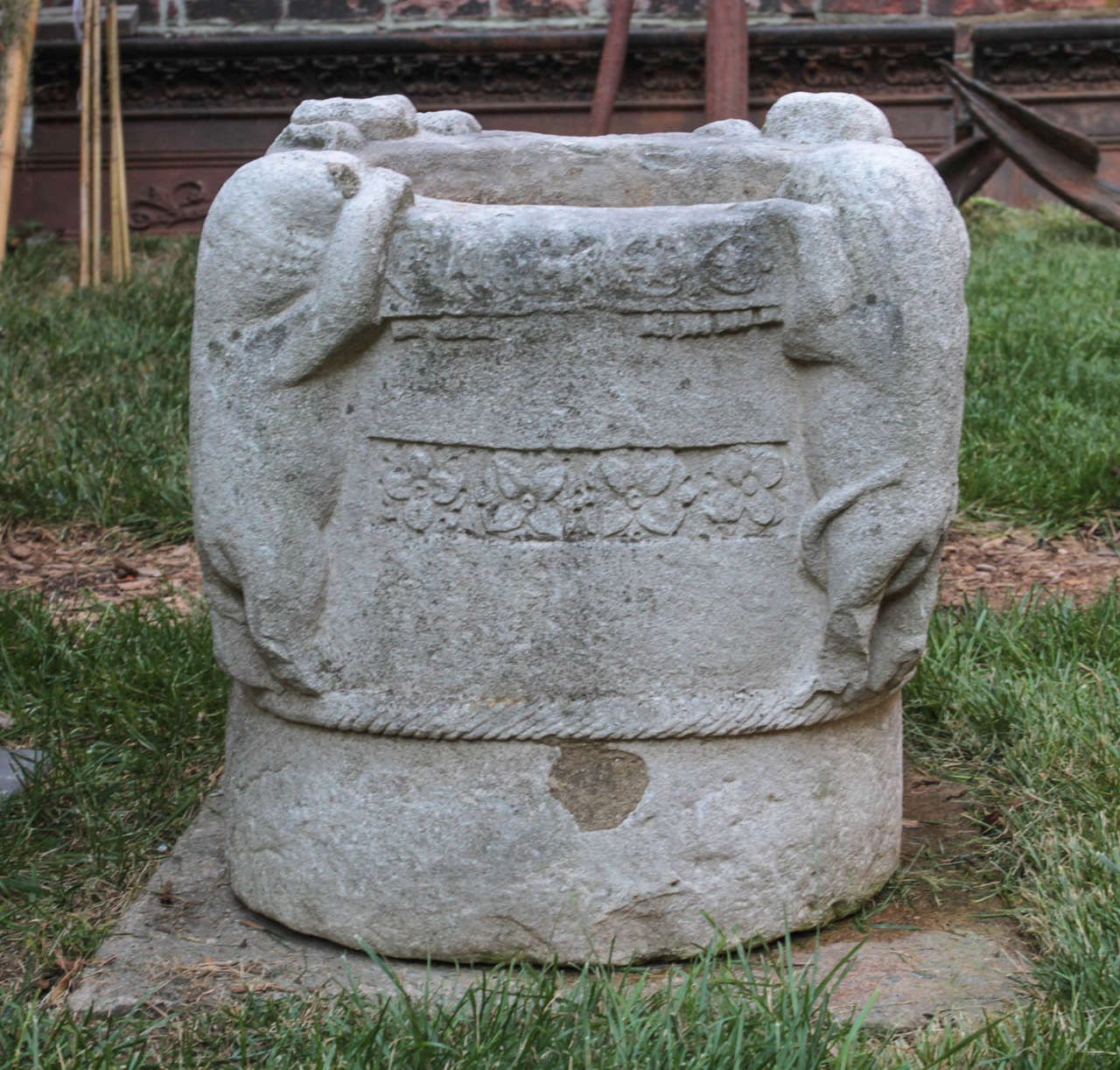 Extremely rare and unique carved stone vessel with four creatures attempting to climb inside at each corner.