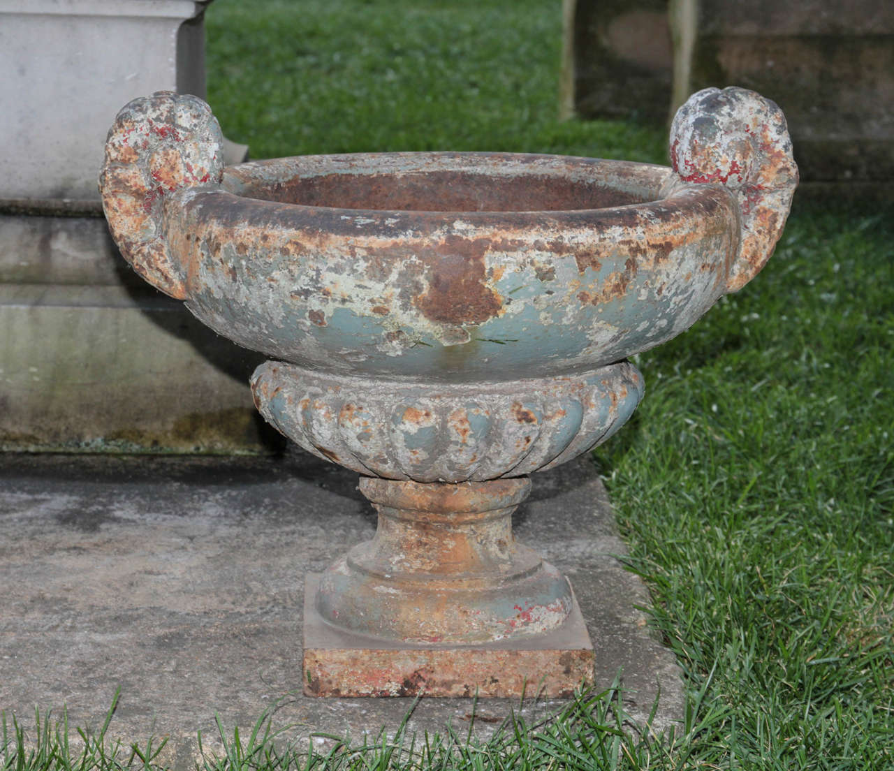 Fabulous and rare pair of early French cast iron urns. Great surface and old paint. Unique form and decoration. Extremely heavy and solid cast.