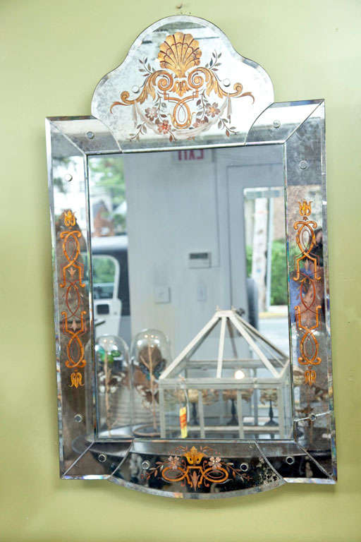 Oxidized mirror frame with naturalistic theme gilt églomisé design.