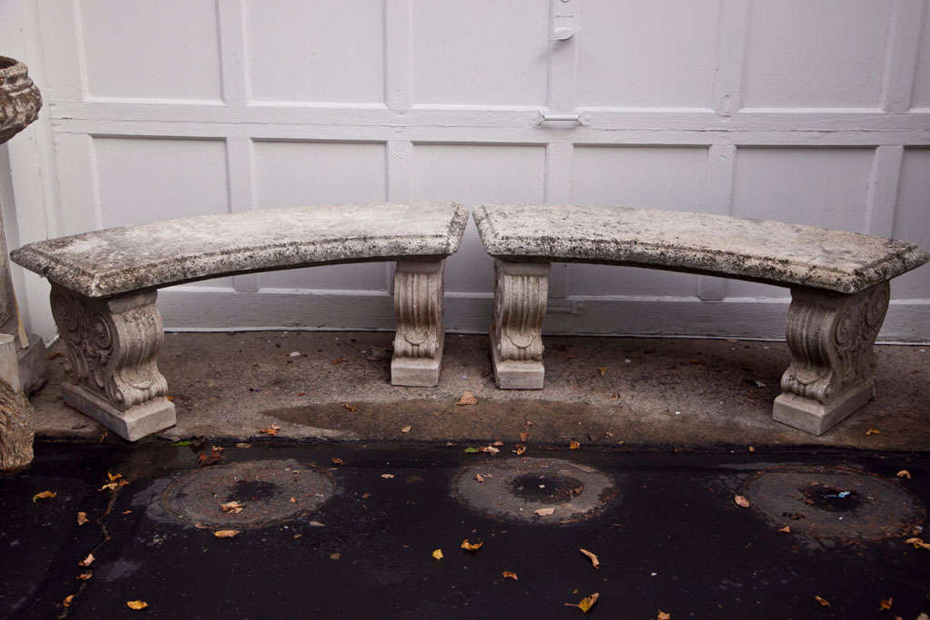 Curved backless seats on decorative scroll form bases