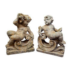 Vintage Pair of Composed Stone Reclining Cherubs