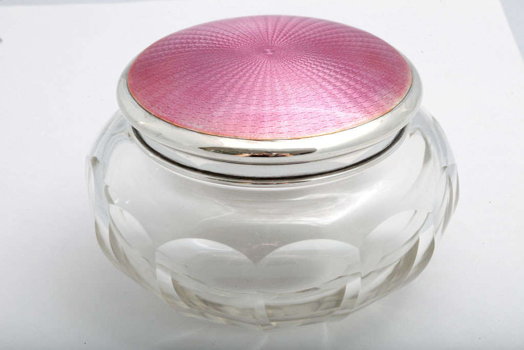 Sterling silver, deep pink enamel and crystal powder jar, Birmingham, England, 1924. Underside of lid is gilt. Enamel 