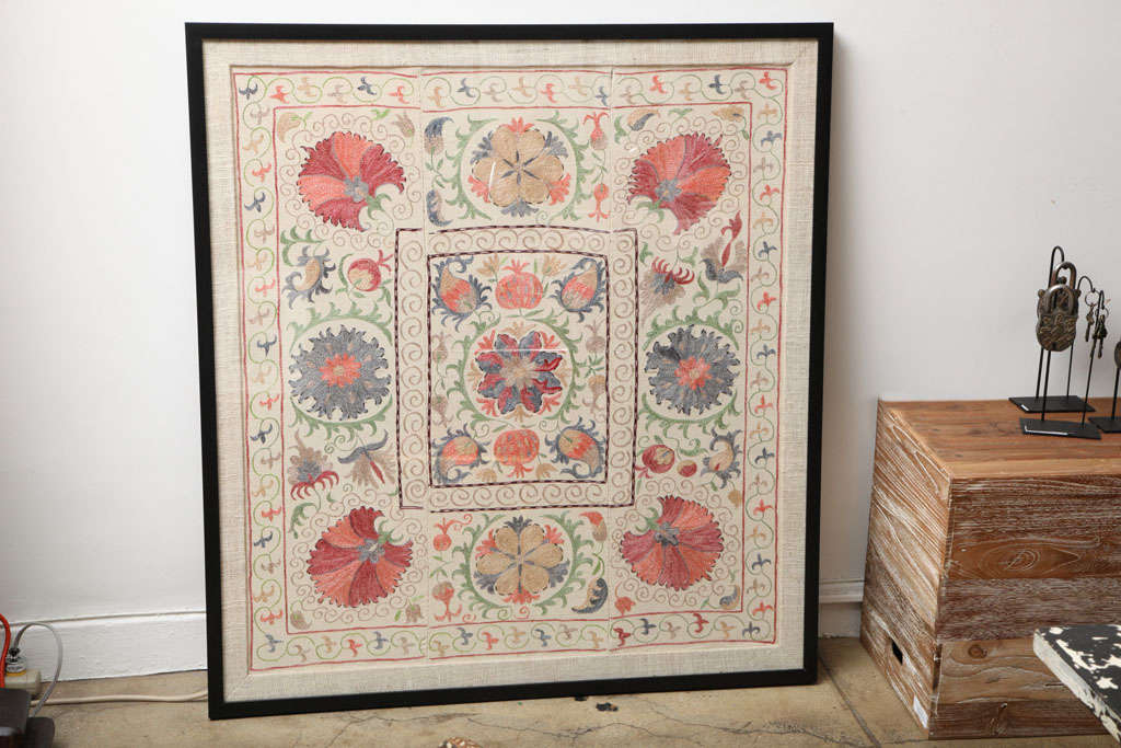 A framed Suzani embroidery from Southwest Asia