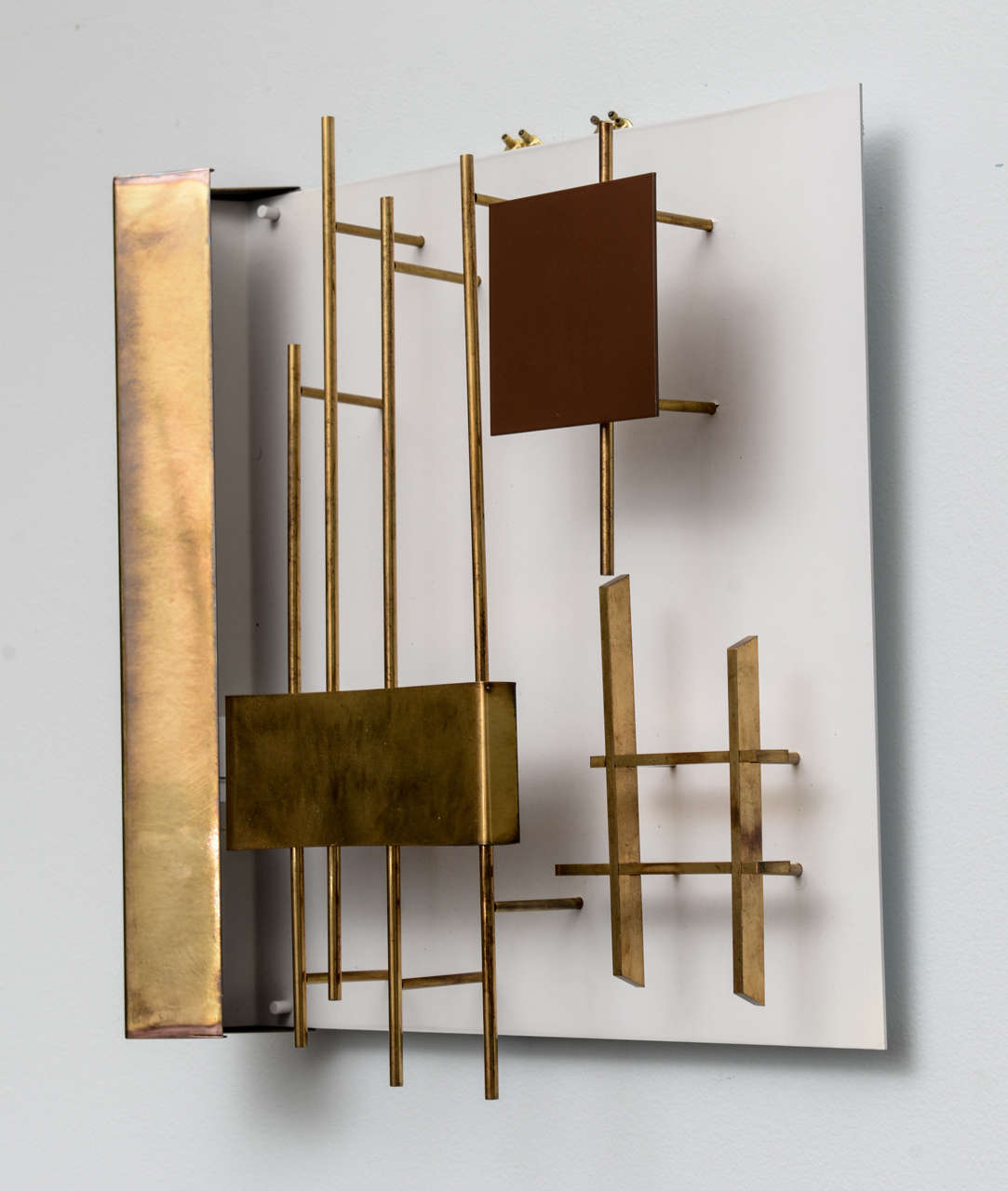 With brass geometric pieces set in an abstract pattern on an enameled back plate
literature- Gio Ponti, Ugo La Pietra
a single of this model sold at wright auction Chicago, 2013, for 8000 plus buyer’s premium.