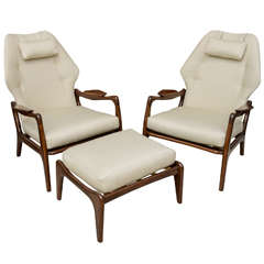 A Pair of Danish Modern Lounge Chairs and Ottoman, by Ib Kofod Larsen