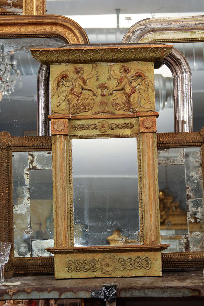 Nice small Italian mirror with green finish and umber showing.
(Image shows reflection of things on opposite wall- slight distressing to the glass but consistent with age).