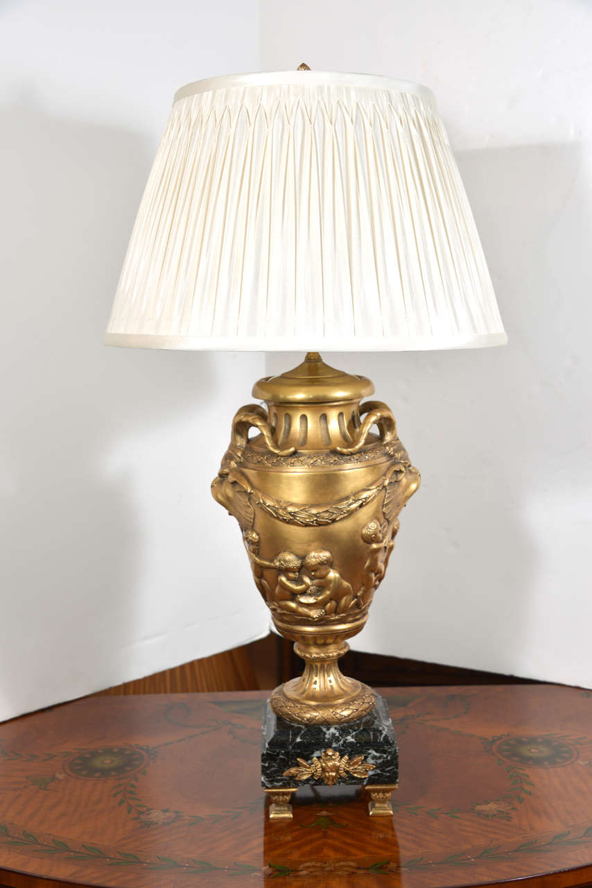 large and beautiful quality pair of 19th c French Clodion bronze dore urn lamps on marble bases