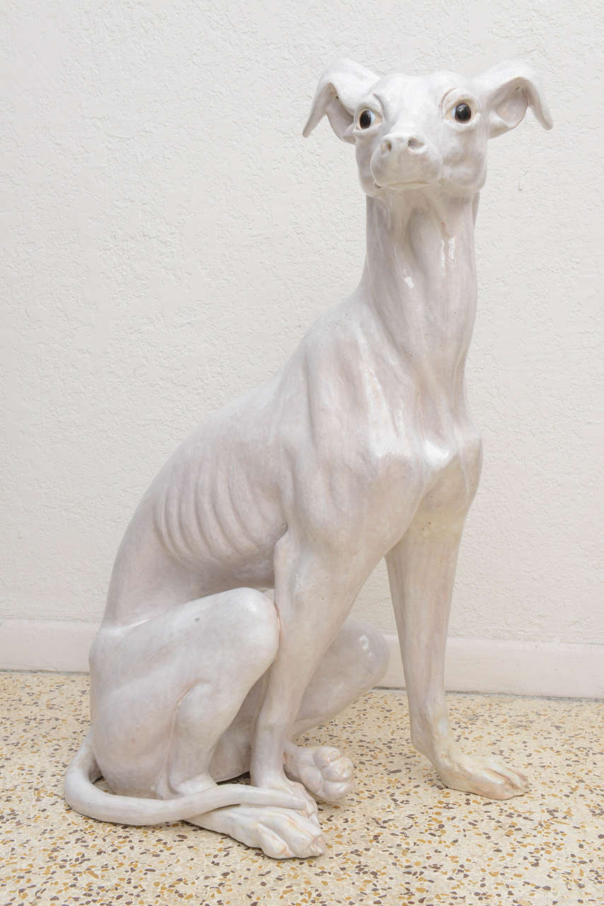 Vintage Italian glazed terracotta greyhound with glass eyes.

Please feel free to contact us directly for a shipping quote or any additional information by clicking 