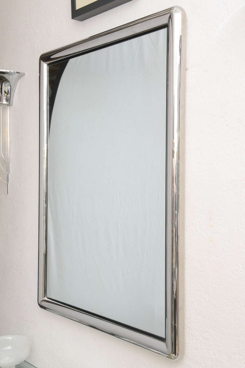 This stylish and clean-lined mirror is very much in the style of pieces created by Karl Springer and dates from the 1970s.  

Please feel free to contact us directly for a shipping quote or any additional information by clicking "Contact