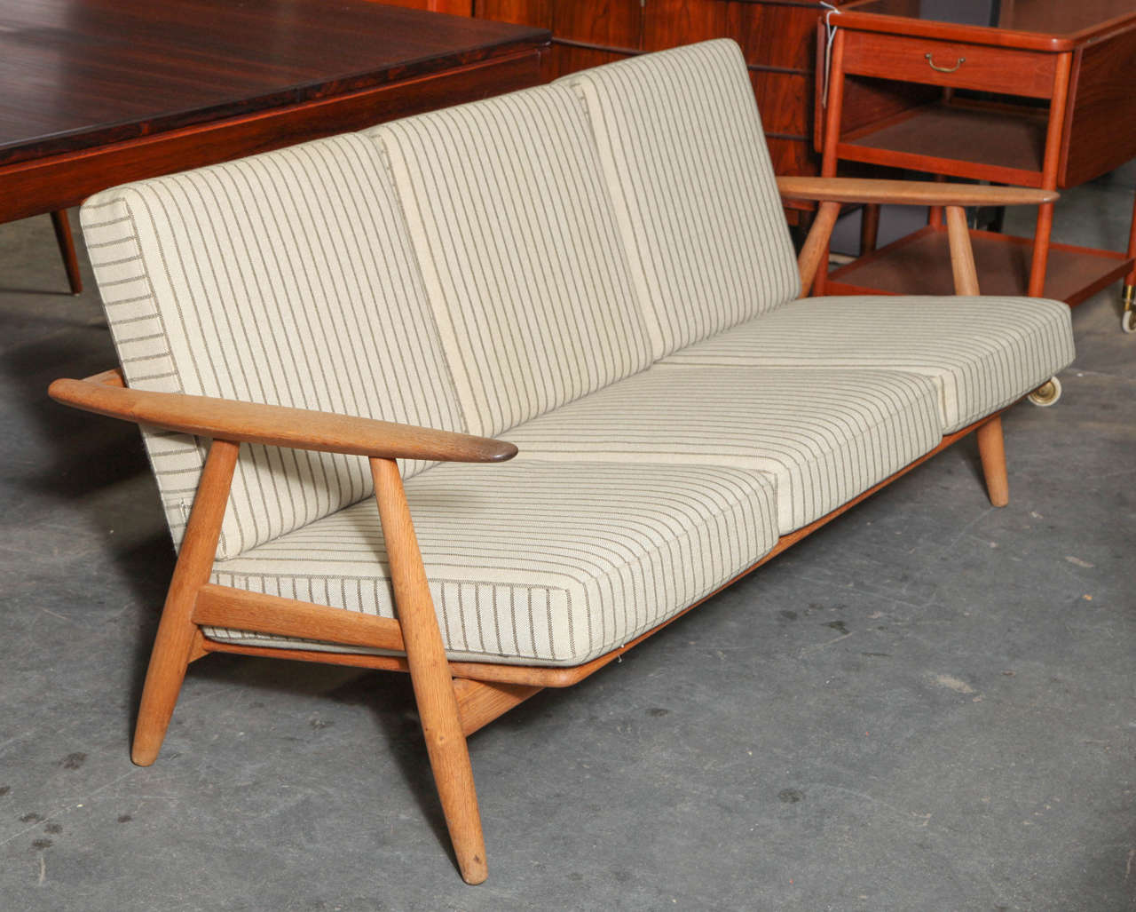Vintage 1950s GETAMA Hans Wegner chair

This Danish sofa is in beautiful vintage condition. The oak is slightly aged and the spring cushions are in like-new condition. All original. Ready for pick up, delivery, or shipping.

Please contact us
