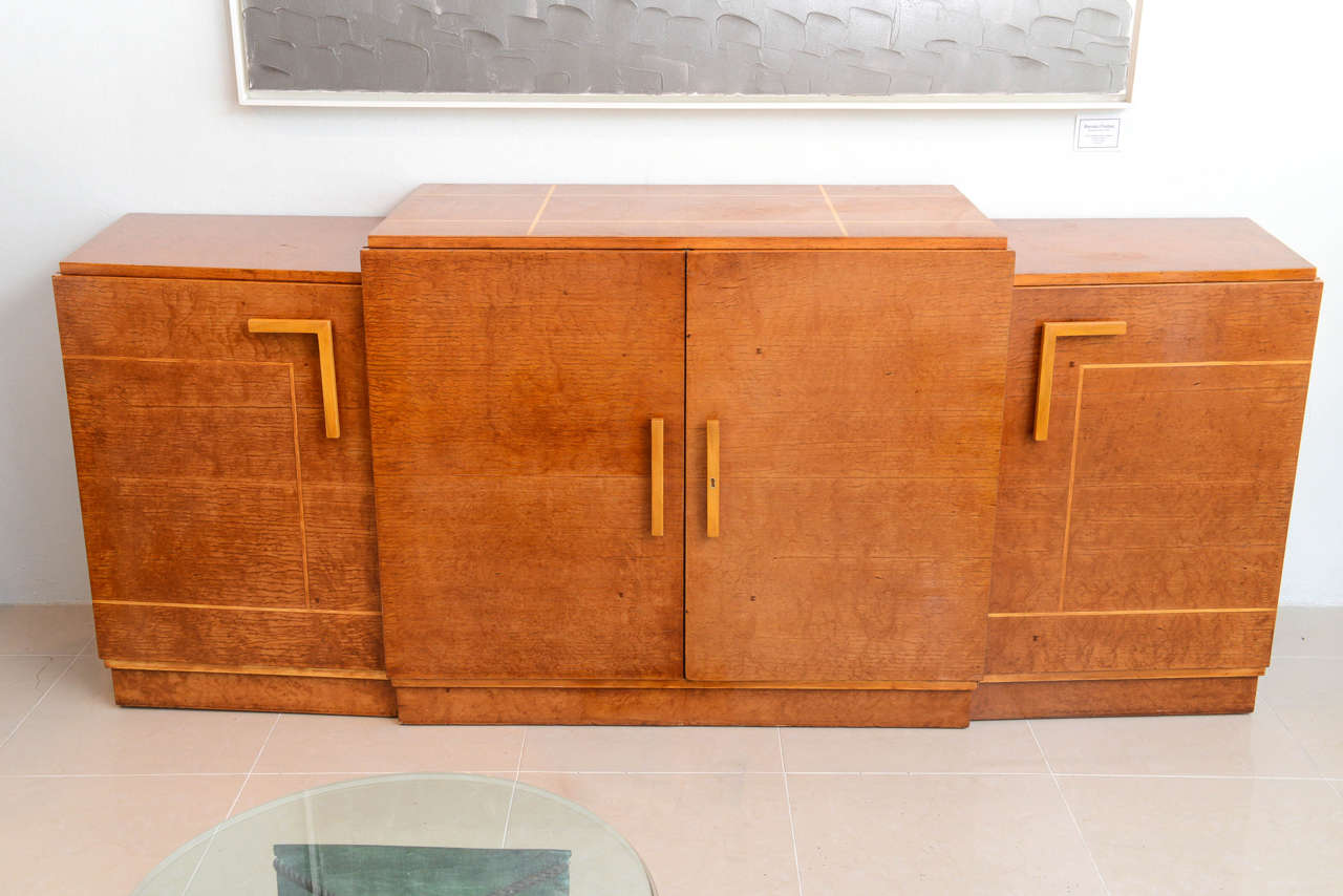 The rectangular top with stepped sides over four doors with line inlay.
signed Eli Jacques Kahn provenance, Ettinger house, Westport, CT, designed by Eli Jacques Kahn in 1939.
The Ettingers were the founders and owners of the legendary Prentice