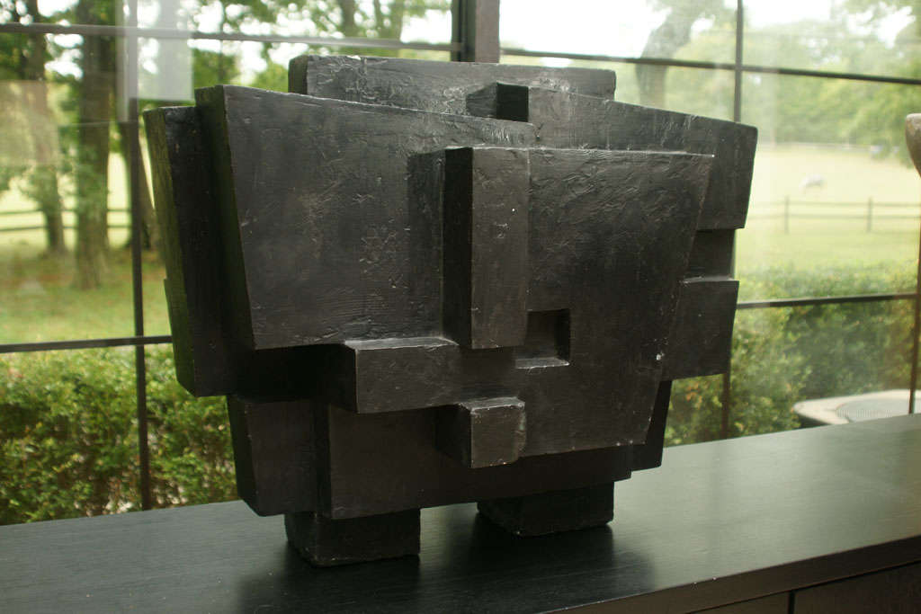A Brutalist sculpture in the style of Parvine Curie. The sculpture is plaster covered in an encaustic black finish, it is believed to have been a study for a much larger bronze which can be seen on his website.