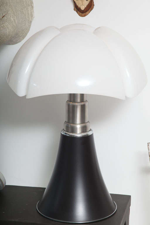 As fresh today as when first designed in the 60's, Gae Aulenti's distinctive Pipistrello lamp can adjust in height from 28