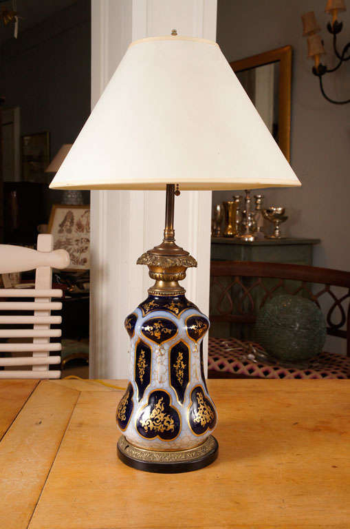 Louis Philippe or Napoleon III cobalt blue, gold and pale blue glass oil lamps, mounted as lamps. Pictured shades not included. Height given to top of 
finial.
 