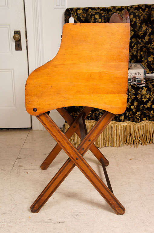 Child's rolltop desk with tambour cover on folding base and burnished decoration on the top rail. Interior writing area painted black.