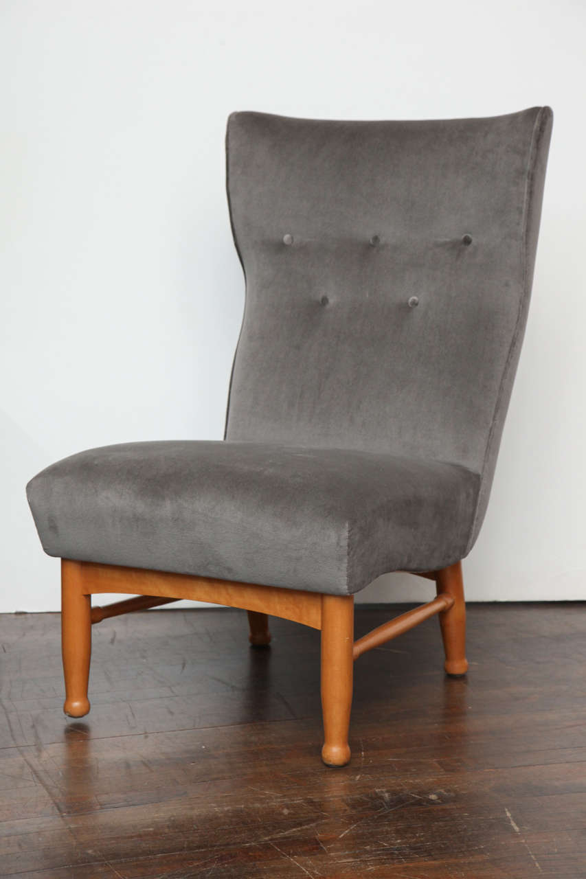 Elegant slipper chair on beautifully sculpted, blond wood legs. Made by and sold through Nordiska Kompaniet, Sweden.