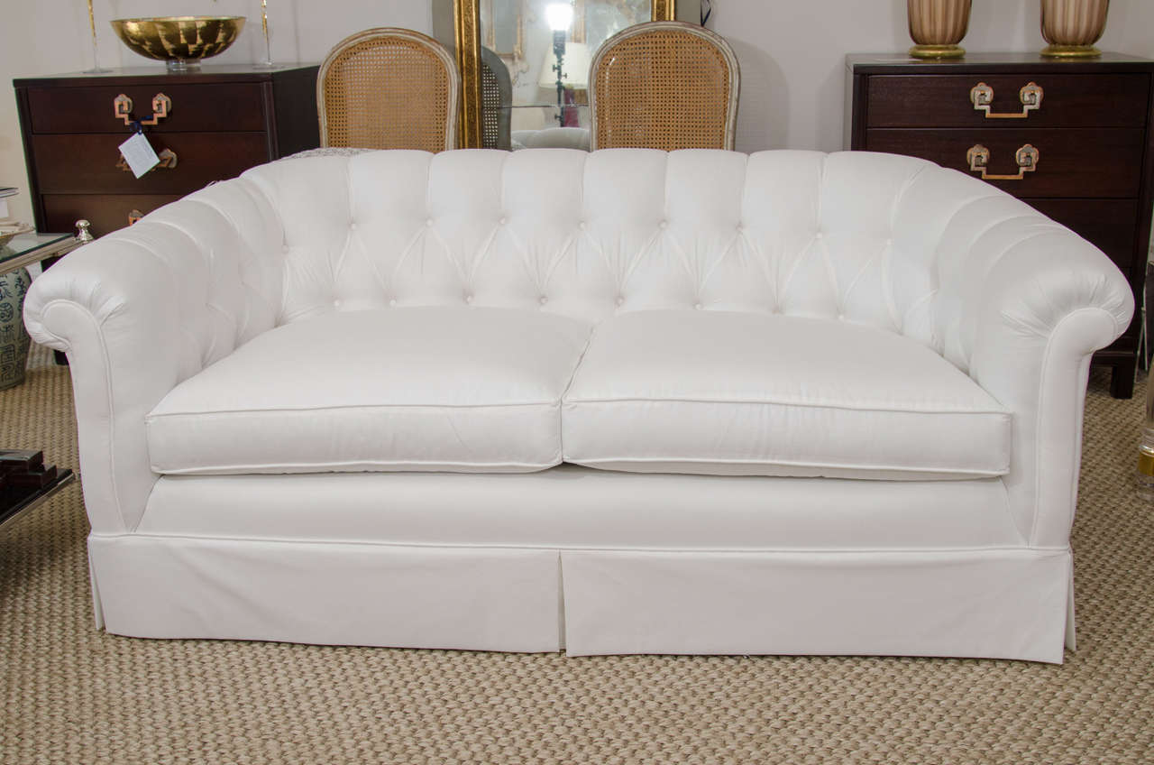 This stylish duo has a tufted, tight back and rolled arms with an inset panel with two-seat cushions. The low profile give this pair a modern, fresh feel.