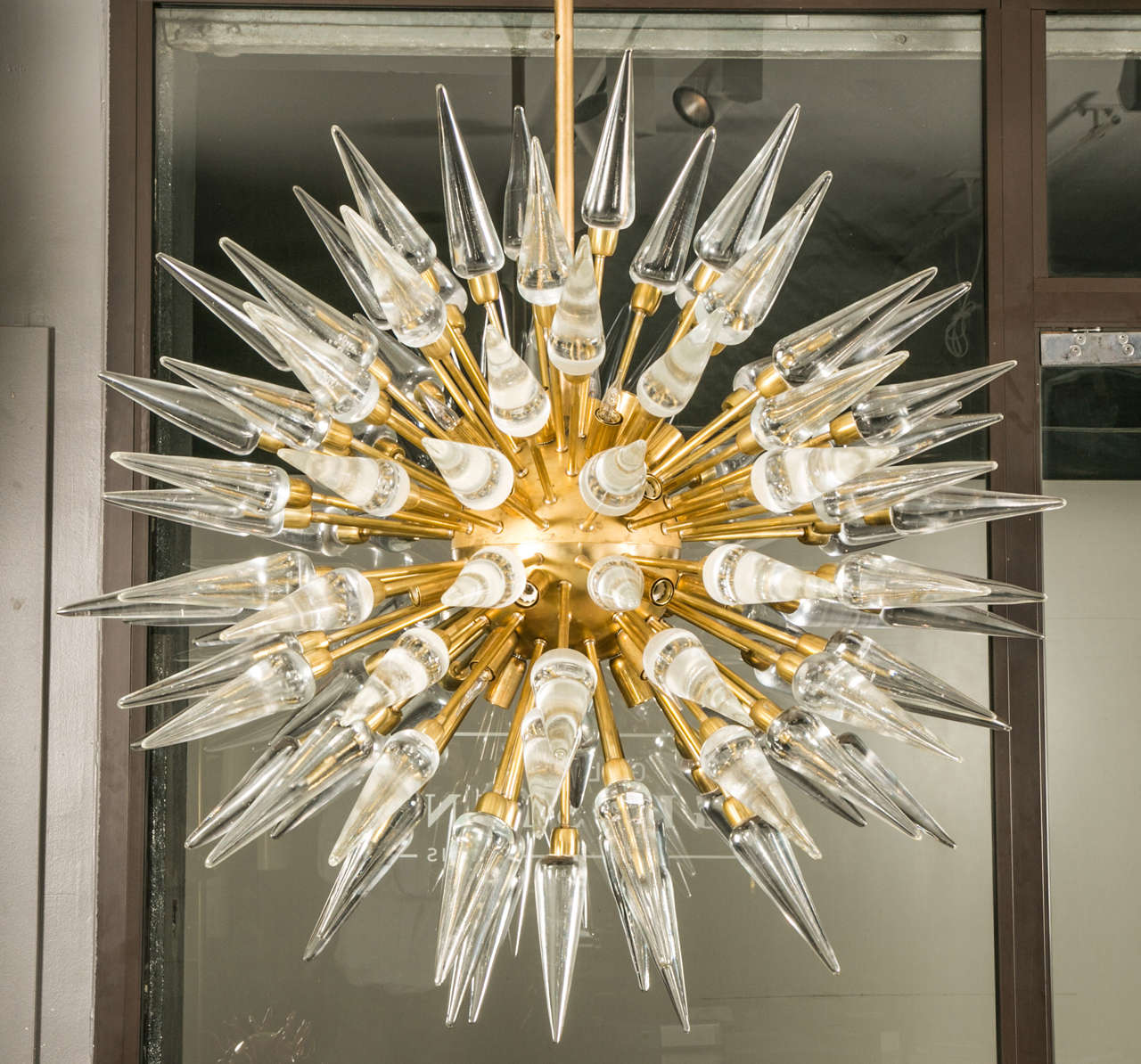 Chandelier in brass and Murano glass picks, approximately 40 lights, possibility to be sold per unit. The structure is recent and the Murano picks are ancient