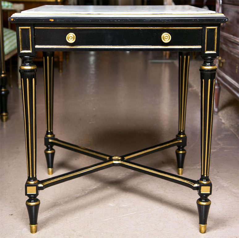 Pair of French Ebonized and Parcel-gilt End Tables