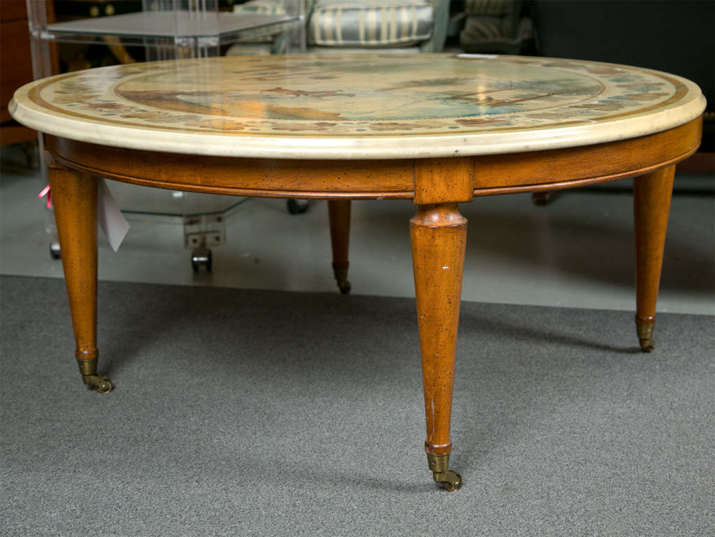 Intriguing Italian walnut base coffee table with circular scagliola marble top that resembles inlaid-pattern in marble. Raised on castors.