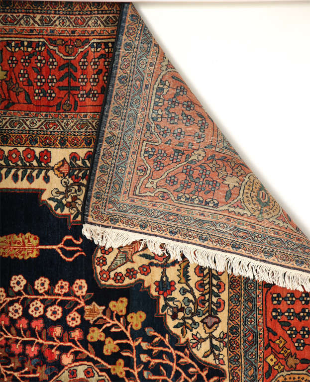 This Persian Sarouk Fereghan carpet created, circa 1880 consists of a cotton warp and weft, hand-knotted pure wool pile, and organic vegetal dyes. It is an exceptionally elegant piece and its size is indicative of its role as a 
