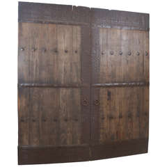 Pair of Antique Elm Doors with Studded Hardware Trim