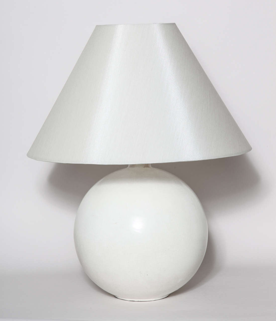 This important lamp base is spherical on a heel and with a short cylindrical neck with white craqueleur enamel.
Has been rewired to U.S. standards.
Signed: 