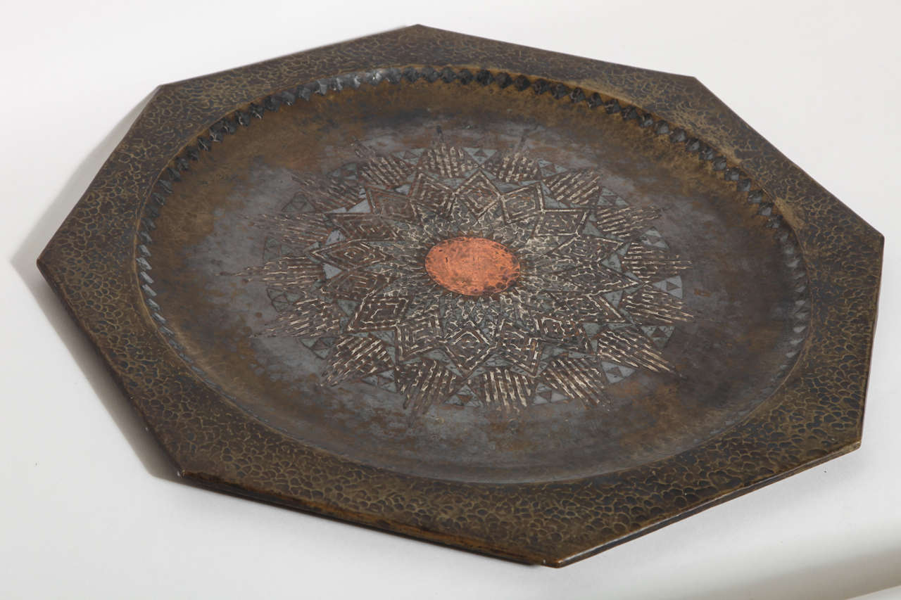 This large octagonal tray has a central copper circle surrounded by an inlaid silver dinanderie design.
Signed:  