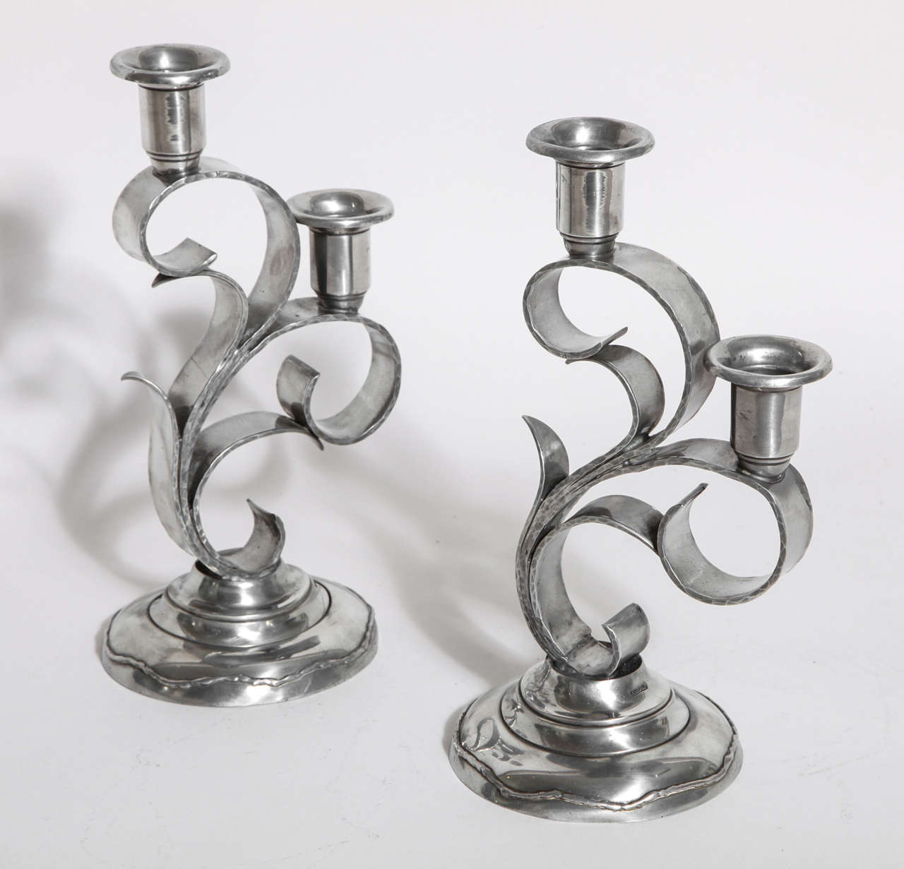 Handwrought dinanderie pewter candelabra with two nozzles on each.
Signed:  