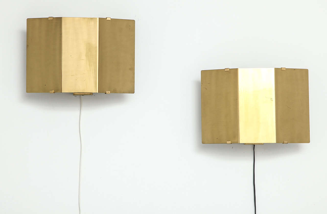 Pair architectural sconces in patinated brass in the manner of Jules Wabbes, Belgium, ca. 1960.