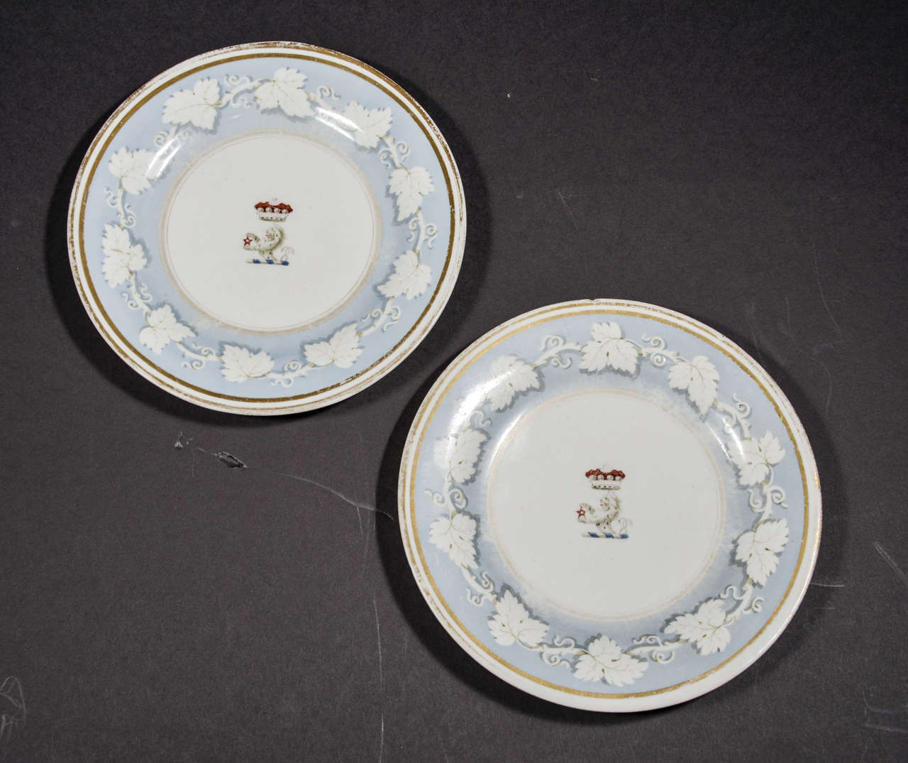 Pair of Flight, Barr & Barr plates (Worchester porcelain) c. 1813-1840.  White with blue transfer leaf border, gold rim, crown over lion in center.