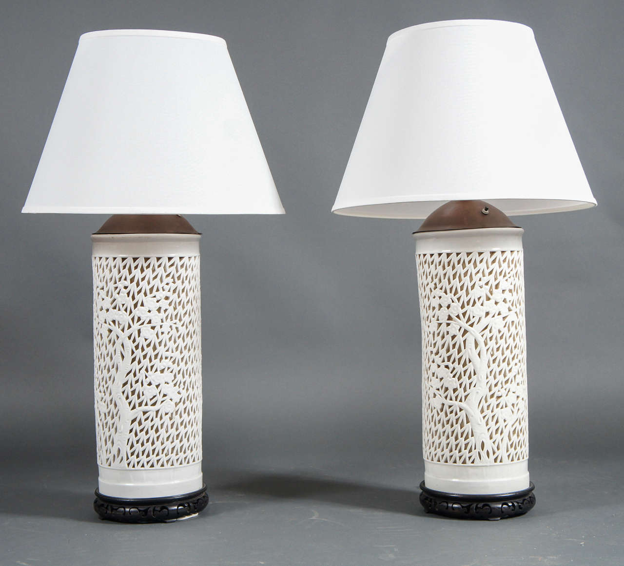 Pair of Japanese porcelain lamps
With lights inside the ceramic base to create a beautiful Silhouette effect when turned on
Base diameter is 9 inches, with shade is 20 inches diameter.