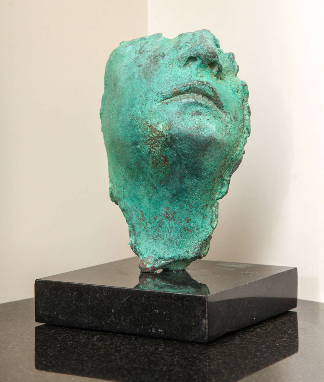 The cast bronze with green patina on granite base is a unique sculpture by the artist. This one-of-a-kind piece. Looks/feels like 